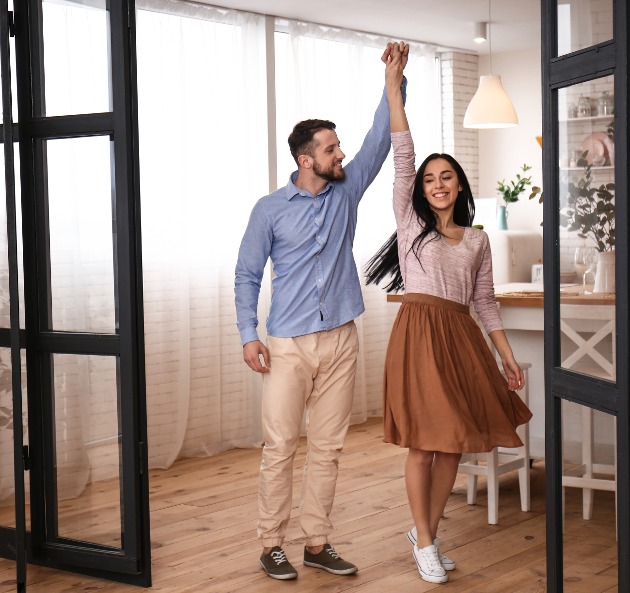 Happy couple celebrating home loan approval in new home. Happy couple celebrating home loan approval in new home.